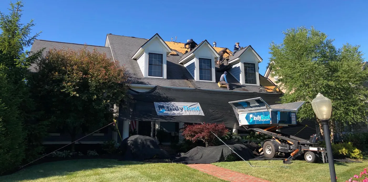 Tarping and dry-in on a Springmill Crossing commercial roof